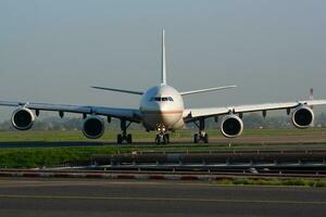 Etihad Airways Airbus A340-600 A6-EHK passenger plane arrival and landing at Paris Charles de Gaulle Airport photo