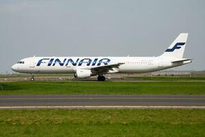 Finnair Airbus A321 OH-LZF passenger plane departure and take off at Paris Charles de Gaulle Airport photo