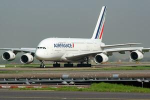 Air France Airbus A380 F-HPJI passenger plane arrival and landing at Paris Charles de Gaulle Airport photo