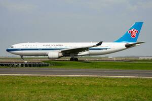 China Southern Airlines Airbus A330-200 B-6515 passenger plane departure and take off at Paris Charles de Gaulle Airport photo