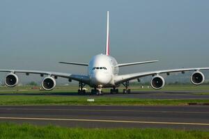 Emirates Airlines Airbus A380 A6-EDX passenger plane arrival and landing at Paris Charles de Gaulle Airport photo