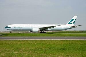 Cathay Pacific Airways Boeing 777-300ER B-16708 passenger plane departure and take off at Paris Charles de Gaulle Airport photo