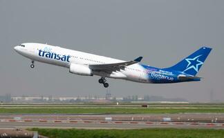 Air Transat Airbus A330-200 C-GTSN passenger plane departure and take off at Paris Charles de Gaulle Airport photo