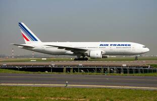 Air France Boeing 777-200 F-GSPR passenger plane arrival and landing at Paris Charles de Gaulle Airport photo