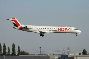 Air France HOP passenger plane at airport. Schedule flight travel. Aviation and aircraft. Air transport. Global international transportation. Fly and flying. photo