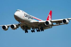 Cargolux cargo plane at airport. Air freight and shipping. Aviation and aircraft. Transport industry. Global international transportation. Fly and flying. photo