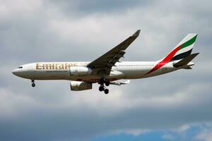 Emirates passenger plane at airport. Schedule flight travel. Aviation and aircraft. Air transport. Global international transportation. Fly and flying. photo