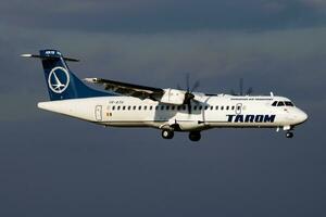 TAROM passenger plane at airport. Schedule flight travel. Aviation and aircraft. Air transport. Global international transportation. Fly and flying. photo