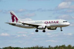 Qatar Airways passenger plane at airport. Schedule flight travel. Aviation and aircraft. Air transport. Global international transportation. Fly and flying. photo