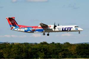 LOT Polish Airlines passenger plane at airport. Schedule flight travel. Aviation and aircraft. Air transport. Global international transportation. Fly and flying. photo