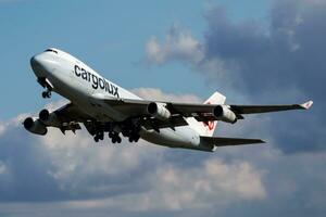 Cargolux cargo plane at airport. Air freight and shipping. Aviation and aircraft. Transport industry. Global international transportation. Fly and flying. photo