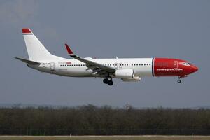 Norwegian Air Shuttle Boeing 737-800 EI-FJM passenger plane arrival and landing at Budapest Airport photo