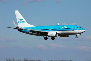 KLM passenger plane at airport. Schedule flight travel. Aviation and aircraft. Air transport. Global international transportation. Fly and flying. photo