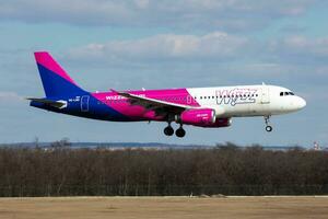 Wizz Air passenger plane at airport. Schedule flight travel. Aviation and aircraft. Air transport. Global international transportation. Fly and flying. photo