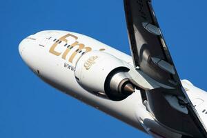 Emirates Airlines passenger plane at airport. Schedule flight travel. Aviation and aircraft. Air transport. Global international transportation. Fly and flying. photo