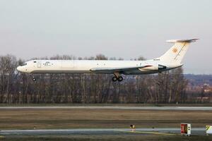 Rada Airlines Ilyushin IL-62 EW-450TR cargo plane arrival and landing at Budapest Airport photo