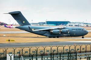 Indian Air Force Boeing C-17A Globemaster III military transport plane and aircraft at Budapest Airport. Evacuation special flight for indian citizens because the Ukraine-Russian war. photo