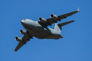 Military transport plane at air base. Air force flight operation. Aviation and aircraft. Air defense. Military industry. Fly and flying. photo