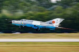 MiG-21 military fighter jet plane at air base. Air force flight operation. Aviation and aircraft. Air defense. Military industry. Fly and flying. photo