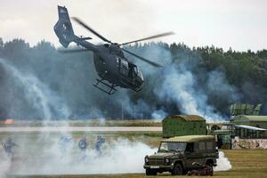 Military helicopter at air base. Air force flight transportation. Aviation and rotorcraft. Transport and airlift. Military industry. Fly and flying. photo