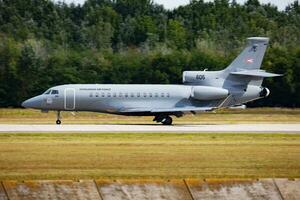 Military transport plane at air base. Air force flight operation. Aviation and aircraft. Air lift. Military industry. Fly and flying. photo