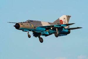 MiG-21 military fighter jet plane at air base. Air force flight operation. Aviation and aircraft. Air defense. Military industry. Fly and flying. photo