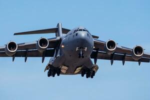 Military transport plane at air base. Air force flight operation. Aviation and aircraft. Air lift. Military industry. Fly and flying. photo