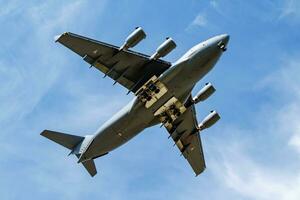 Military transport plane at air base. Air force flight operation. Aviation and aircraft. Air lift. Military industry. Fly and flying. photo