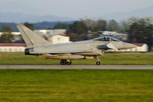 Military fighter jet plane at air base. Air force flight operation. Aviation and aircraft. Air defense. Military industry. Fly and flying. photo