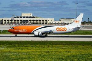 TNT Airways cargo plane at airport. Air freight and shipping. Aviation and aircraft. Transport industry. Global international transportation. Fly and flying. photo