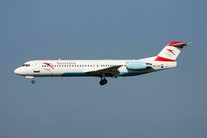 Austrian Airlines passenger plane at airport. Schedule flight travel. Aviation and aircraft. Air transport. Global international transportation. Fly and flying. photo