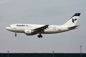 Iran Air passenger plane at airport. Schedule flight travel. Aviation and aircraft. Air transport. Global international transportation. Fly and flying. photo
