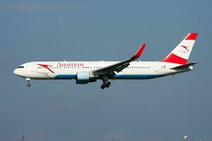 Austrian Airlines passenger plane at airport. Schedule flight travel. Aviation and aircraft. Air transport. Global international transportation. Fly and flying. photo