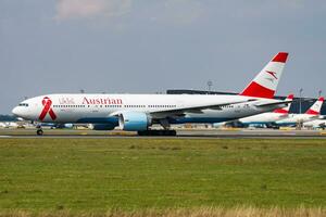 Austrian Airlines passenger plane at airport. Schedule flight travel. Aviation and aircraft. Air transport. Global international transportation. Fly and flying. photo