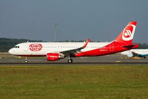 Flyniki passenger plane at airport. Schedule flight travel. Aviation and aircraft. Air transport. Global international transportation. Fly and flying. photo