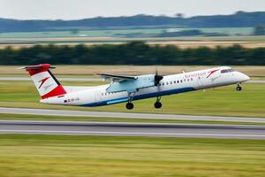 Austrian Airlines passenger plane at airport. Schedule flight travel. Aviation and aircraft. Air transport. Global international transportation. Fly and flying. photo