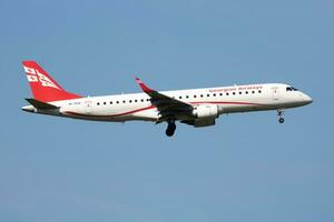 Georgian Airways Embraer ERJ-190 4L-TGV passenger plane arrival and landing at Vienna Airport photo