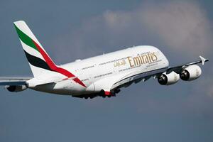 Emirates Airlines Airbus A380 A6-EUJ passenger plane departure and take off at Vienna Airport photo