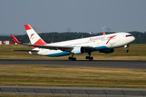 Austrian Airlines Boeing 767-300 OE-LAX passenger plane deaprture and take off at Vienna Airport photo