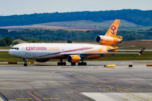 Centurion Air Cargo MD-11 N986AR cargo plane arrival and landing at Vienna Airport photo