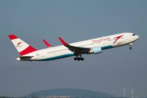 Austrian Airlines Boeing 767-300 OE-LAX passenger plane deaprture and take off at Vienna Airport photo