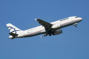 Aegean Airlines Airbus A320 SX-DVT passenger plane departure and take off at Vienna Airport photo