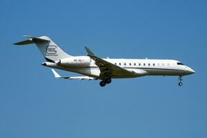 Glock Aviation Bombardier BD-700 Global 6000 OE-IGL passenger plane arrival and landing at Vienna Airport photo
