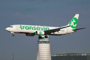 Transavia Boeing 737-800 PH-HZM passenger plane arrival and landing at Vienna Airport photo