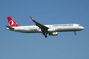 Turkish Airlines Airbus A321 TC-JTJ passenger plane arrival and landing at Vienna Airport photo