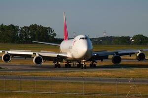 Asiana Cargo Boeing 747-400 HL7420 cargo plane arrival and landing at Vienna Airport photo