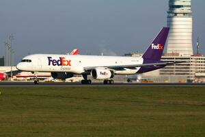 FedEx Boeing 757-200 N972FD cargo plane departure and take off at Vienna International Airport photo