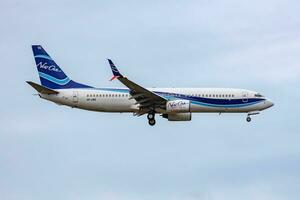 NewGen Airways Boeing 737-800 SP-LWE passenger plane arrival and landing at Vienna International Airport photo