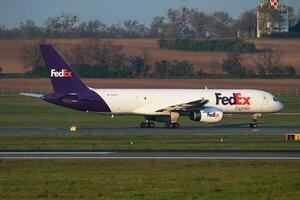 FedEx Boeing 757-200 N918FD cargo plane departure and take off at Vienna International Airport photo