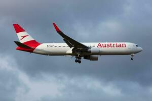 Austrian Airlines Boeing 767-300 OE-LAE passenger plane arrival and landing at Vienna International Airport photo